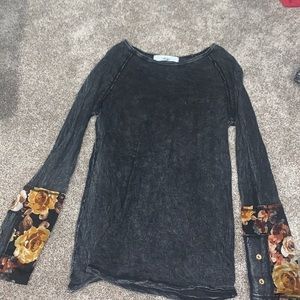 Gray and floral long-sleeve blouse.